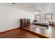 Bedroom with wood floors, ceiling fan, dresser, bed, and natural light at 5152 Clearwater Dr, Stone Mountain, GA 30087