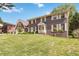 A two-story brick home featuring a well-maintained front yard and traditional architectural design at 5152 Clearwater Dr, Stone Mountain, GA 30087