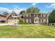 Charming two-story brick home with a well-manicured lawn and inviting curb appeal at 5152 Clearwater Dr, Stone Mountain, GA 30087