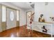 Inviting foyer with hardwood floors, chandelier, staircase, and decorative console table at 5152 Clearwater Dr, Stone Mountain, GA 30087