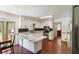 Spacious eat-in kitchen featuring white cabinets, stainless steel appliances, and hardwood floors at 5152 Clearwater Dr, Stone Mountain, GA 30087