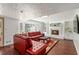 Cozy living room with a fireplace, built-in shelving, and large windows at 5152 Clearwater Dr, Stone Mountain, GA 30087