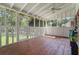 Enclosed porch featuring wood floors and ceiling and screened windows at 5152 Clearwater Dr, Stone Mountain, GA 30087