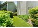 Well-manicured backyard with artificial turf and lush landscaping at 1115 Third St, Stone Mountain, GA 30083
