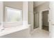 Well-lit bathroom with soaking tub and shower, features modern fixtures at 1115 Third St, Stone Mountain, GA 30083
