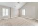 Spacious bedroom with vaulted ceiling, neutral carpet and large window with plantation shutters at 1115 Third St, Stone Mountain, GA 30083