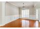Charming dining room with hardwood floors, plantation shutters and decorative molding at 1115 Third St, Stone Mountain, GA 30083