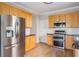 Kitchen view featuring stainless steel appliances and natural wood cabinets and countertop at 1115 Third St, Stone Mountain, GA 30083