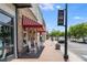 Stone Mountain Village with rocking chairs outside store and a welcome sign for visitors and tourists at 1115 Third St, Stone Mountain, GA 30083