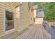 Spacious back deck with wooden railings and yellow siding, ideal for outdoor entertaining and relaxation at 115 Eagle Ridge Dr, Canton, GA 30114