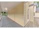Wide back porch with ceiling and gray wood floor for relaxing and enjoying backyard views at 115 Eagle Ridge Dr, Canton, GA 30114