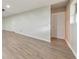 A finished basement featuring laminate flooring and a clean, neutral color scheme at 115 Eagle Ridge Dr, Canton, GA 30114