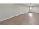 A finished basement featuring laminate flooring and a clean, neutral color scheme at 115 Eagle Ridge Dr, Canton, GA 30114