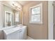 Bathroom features a modern vanity, bright lighting, a large mirror, plenty of natural light, and a window at 115 Eagle Ridge Dr, Canton, GA 30114