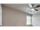 Bright bedroom featuring a ceiling fan, neutral walls, and a window for natural light at 115 Eagle Ridge Dr, Canton, GA 30114