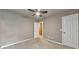 Bedroom features neutral walls, plush carpet, and a ceiling fan with light fixture at 115 Eagle Ridge Dr, Canton, GA 30114