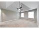 Spacious bedroom features plush carpeting, neutral walls, a modern ceiling fan, and plenty of natural light from two windows at 115 Eagle Ridge Dr, Canton, GA 30114