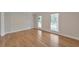 Bedroom featuring hardwood floors and windows, offering a serene atmosphere at 115 Eagle Ridge Dr, Canton, GA 30114