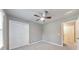 Bedroom features neutral walls, plush carpet, and a ceiling fan with light fixture at 115 Eagle Ridge Dr, Canton, GA 30114