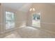 Bright dining room featuring tiled floor, chair rail, and large windows offering plenty of natural light at 115 Eagle Ridge Dr, Canton, GA 30114