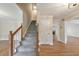 Welcoming foyer featuring a staircase, hardwood floors, and neutral walls, creating an inviting entrance at 115 Eagle Ridge Dr, Canton, GA 30114