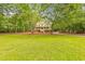 Charming two-story home with inviting front porch and beautifully landscaped yard at 115 Eagle Ridge Dr, Canton, GA 30114