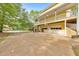 Two-story home with a ground-level two-car garage, and a spacious driveway at 115 Eagle Ridge Dr, Canton, GA 30114