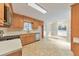 Functional kitchen featuring light wood cabinets, modern appliances, and a sunlit dining area at 115 Eagle Ridge Dr, Canton, GA 30114