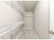 Walk-in closet featuring neutral walls, plush carpeting, a base trim and multiple white wire shelves for ample storage at 115 Eagle Ridge Dr, Canton, GA 30114
