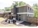 A well-maintained backyard with a patio, wooden stairs, and a wooden privacy fence at 2991 Windfield Cir, Tucker, GA 30084