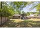 A large backyard showcasing the back of the house, a patio, and ample green space at 2991 Windfield Cir, Tucker, GA 30084