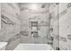 Modern bathroom features a bathtub, stylish marble tiles, and a shower with a rain shower head at 2991 Windfield Cir, Tucker, GA 30084
