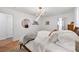 Light-filled bedroom with hardwood floors, walk-in closet, and stylish decor at 2991 Windfield Cir, Tucker, GA 30084
