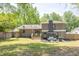 A well-maintained backyard with a patio, privacy fence, and manicured landscaping at 2991 Windfield Cir, Tucker, GA 30084