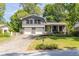 Charming two-story home with a well-manicured lawn and welcoming front entrance with a bright yellow door at 2991 Windfield Cir, Tucker, GA 30084