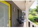 Inviting front porch with modern seating, a bright door, and stylish accents, perfect for relaxing outdoors at 2991 Windfield Cir, Tucker, GA 30084