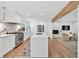 Contemporary kitchen featuring a large island, stainless steel appliances, and open layout to living area at 2991 Windfield Cir, Tucker, GA 30084