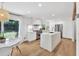Sleek, modern kitchen with white cabinetry, stainless steel appliances, and a large island, perfect for entertaining at 2991 Windfield Cir, Tucker, GA 30084