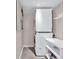 Efficient laundry room with stacked washer and dryer plus storage space at 2991 Windfield Cir, Tucker, GA 30084