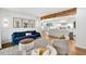 Bright and inviting living room with hardwood floors, plush seating, and access to the kitchen and dining area at 2991 Windfield Cir, Tucker, GA 30084