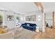 Inviting living room featuring hardwood floors, modern lighting, and stylish furniture for a cozy gathering space at 2991 Windfield Cir, Tucker, GA 30084
