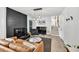 Inviting living room with a black brick fireplace, sleek lighting, and modern furnishings at 2991 Windfield Cir, Tucker, GA 30084