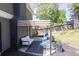 Relaxing patio with a pergola, comfortable seating, and well-maintained landscaping at 2991 Windfield Cir, Tucker, GA 30084