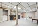 The finished basement has a bar area, tile ceilings, support beams, and laundry at 3679 Regent Nw Dr, Kennesaw, GA 30144