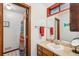 Inviting bathroom featuring a vanity, a sink, and a shower with a decorative curtain at 3679 Regent Nw Dr, Kennesaw, GA 30144