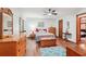 Bright bedroom with wood floors, matching dressers, and a vibrant, colorful comforter at 3679 Regent Nw Dr, Kennesaw, GA 30144