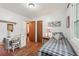 This bedroom features wood flooring, a desk, a twin bed, and ample natural light at 3679 Regent Nw Dr, Kennesaw, GA 30144