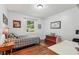 Cozy bedroom with a window providing ample natural light at 3679 Regent Nw Dr, Kennesaw, GA 30144