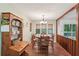 Bright dining room with a view of the deck and wooded outdoors at 3679 Regent Nw Dr, Kennesaw, GA 30144