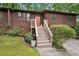 Charming split level home with an orange door and mature landscaping at 3679 Regent Nw Dr, Kennesaw, GA 30144